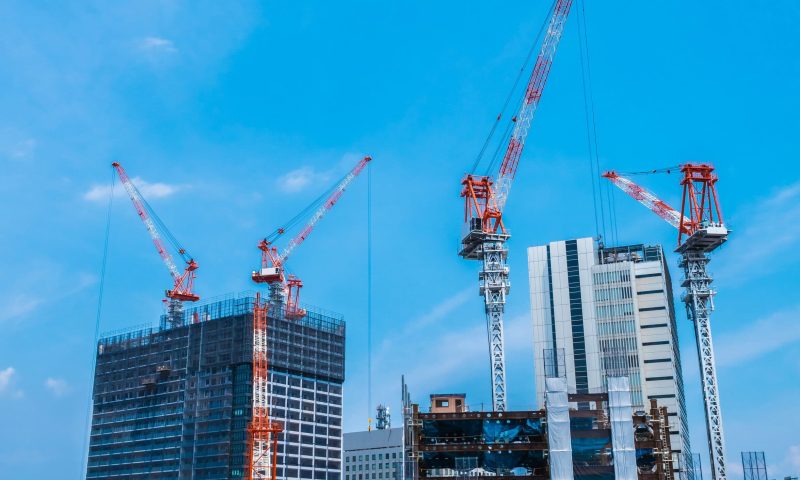 Crane building under construction exterior with sky background
